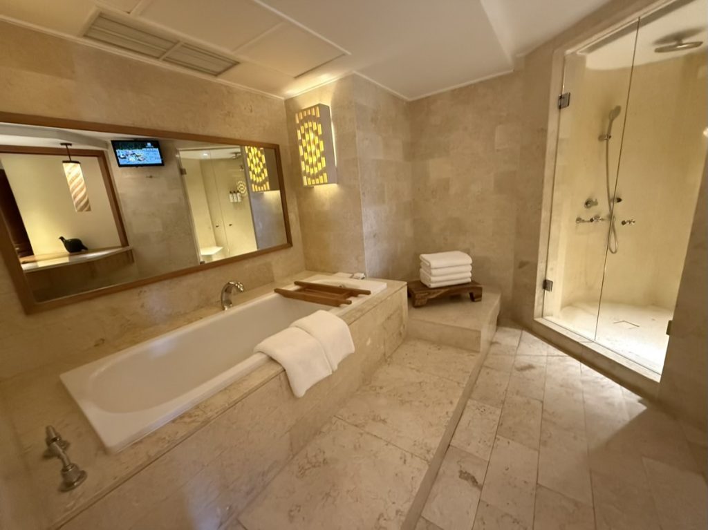 The marble bathroom had its own TV
