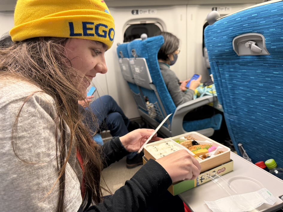 Eating our Bento Box dinners on our way to Tokyo