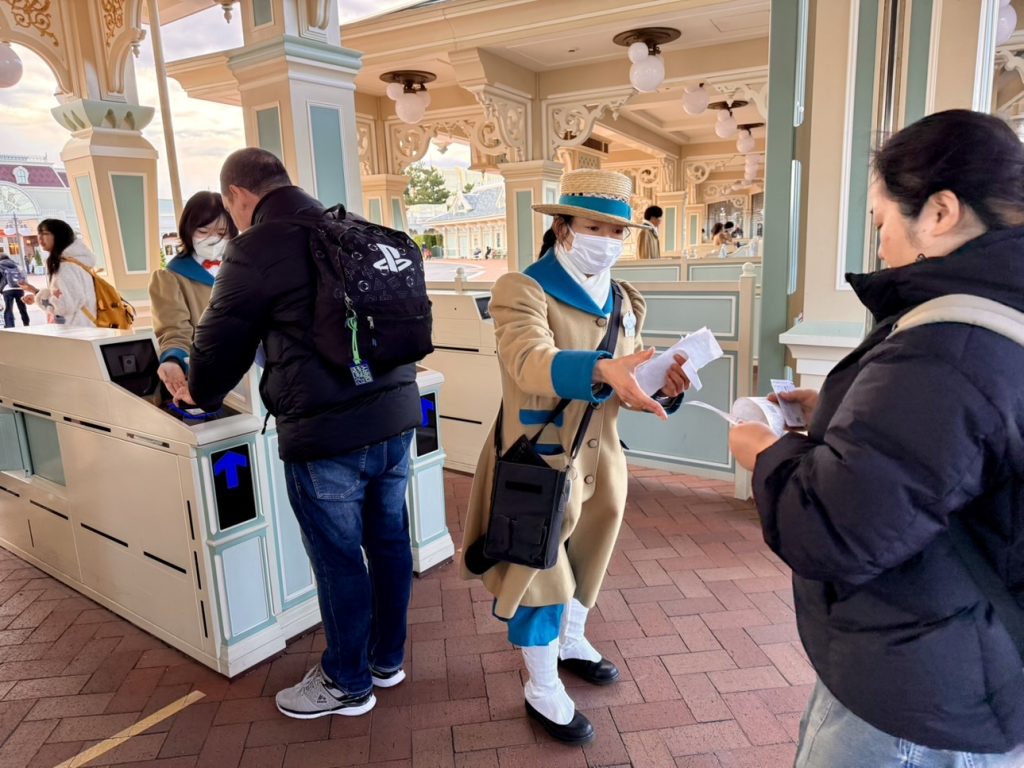 Tokyo Disneyland Happy Entry paper slips being collected