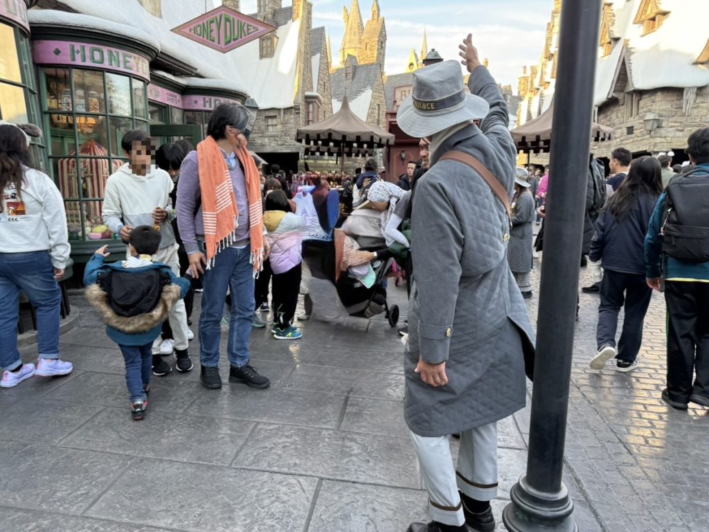 A Universal Studios Japan VIP Tour Guide with his private group inside the Wizarding World of Harry Potter